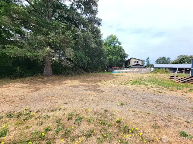 50x100 flat lot just east of Pacific Hwy 103 offers quick access to Discovery Trail, restaurants and services near Pioneer St plus public beach approaches. Septic installed, power in street, public water short distance away...