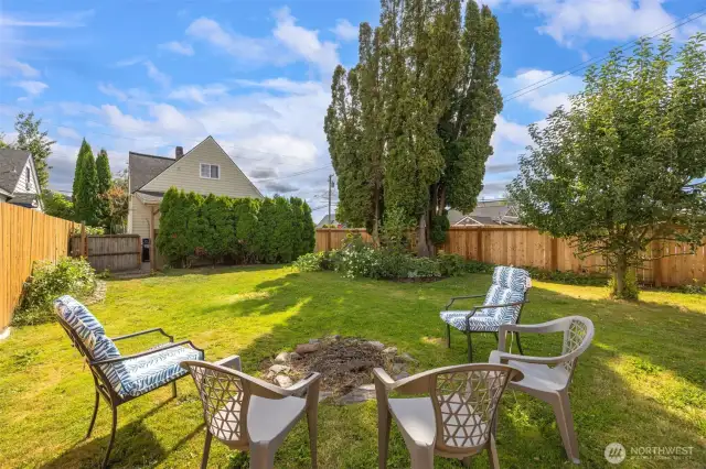 Large fenced back yard is a wonderful spot for a lazy afternoon.  Big enough to play in and have a vegetable garden.  Nice space to have your animals as well. Enjoy the apple tree, blueberry bushes and raspberries as well.