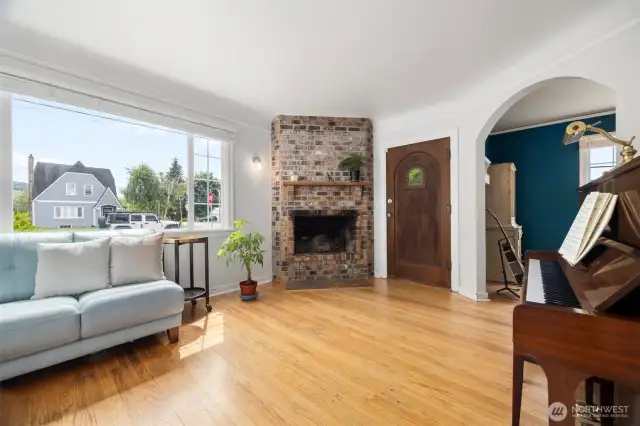 Main living area is amazing.  Looks at that lovely window view to enjoy this character home in a character neighborhood. These vintage homes are a rare find.  The solid wood front door welcomes you and your guest from a sheltered cover porch. Beautifully restored wood flooring and curved entry passages to the other rooms in this lovely home allow you to enjoy the true craftsmanship of days gone by.