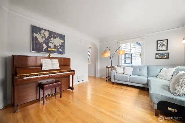 The wood floor was meticulously refurbished to shine the rich natural hues of the wood.  Light and airy with the charming doorways showing the depth of the vintage character this home offers. Come fall in love with craftsmanship that we rarely see in current homes.