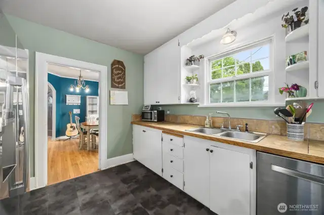 Kitchen with solid cabinets for storage and a nice appliances.