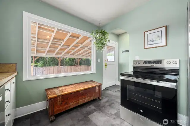 Back door entry allow easy access to cars and fenced back yard.  There is a handy space to hang coats and leave your shoes right by the door.  Space also for a small sitting bench. for company to sit and visit in the kitchen or a place you can easily places shoes off and on, or use the sitting area for setting down your shopping, or organizing your items for the day.