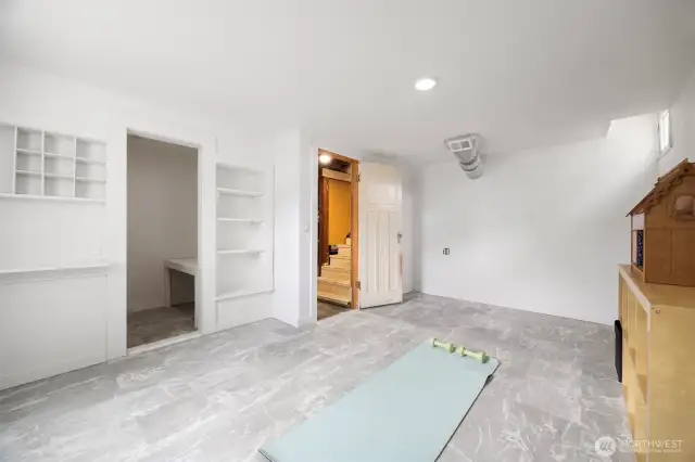 Additional bedroom space finished off in the basement level. It has lots of natural light, a closet, heat and privacy. This is a wonderful 4th bedroom or could be a workout room, office. It has outside access from the carport as well as inside access from the main level of the house.  Legal window well egress was added to give safe quick exit if needed. This additional space offers so many options.
