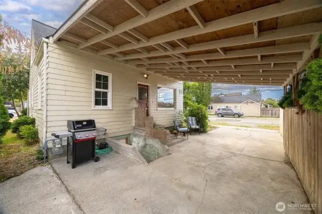 Carport offers covered parking and cover from the elements as well as an outdoor space to hangout in.