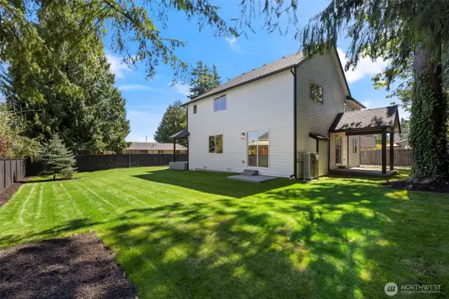 Sunny north yard with the covered Outdoor Living area for Barbeque or beat the heat shaded quiet congregation.