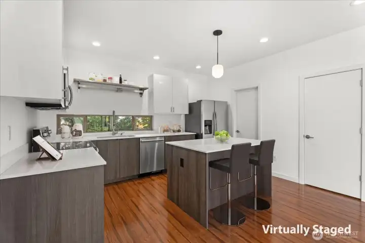 Just the right size kitchen. The door in the back left corner is the Powder Room.