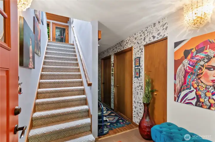 Entry, Kitchen, primary and additional bedroom upstairs.