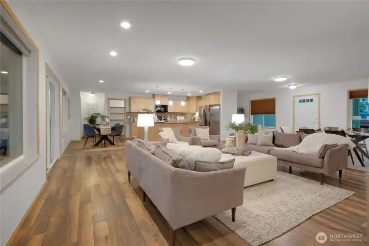 open concept common area staged with dining and living area