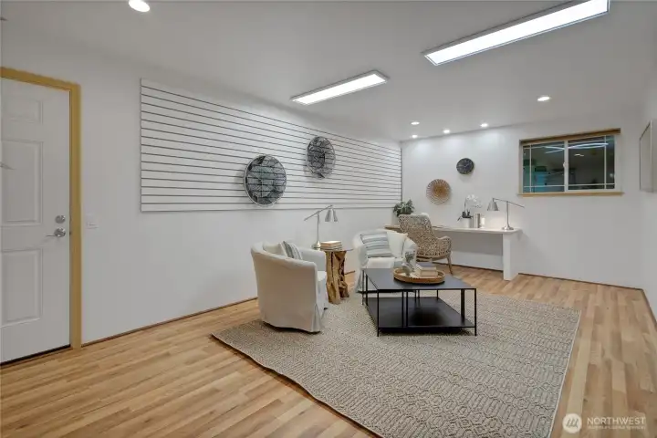 staged bonus area full of possibilities with built in desk and slat wall