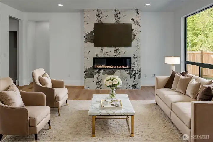 Statement fireplace in living room (virtually staged, photo of similar home in separate community)