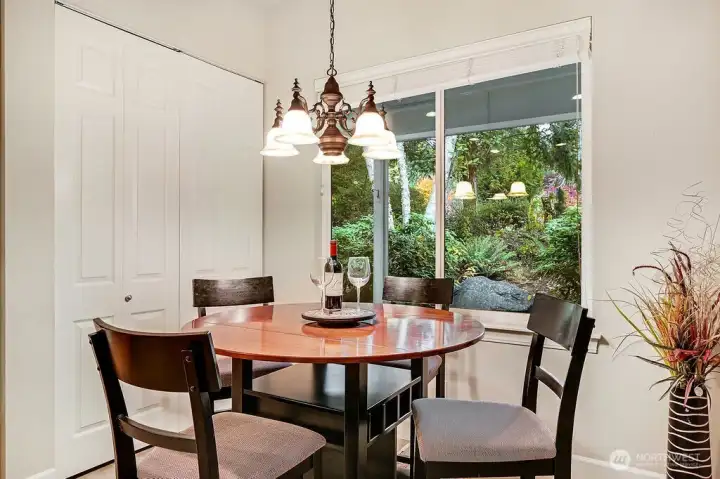 Kitchen eating area with windows to enjoy the landscape.