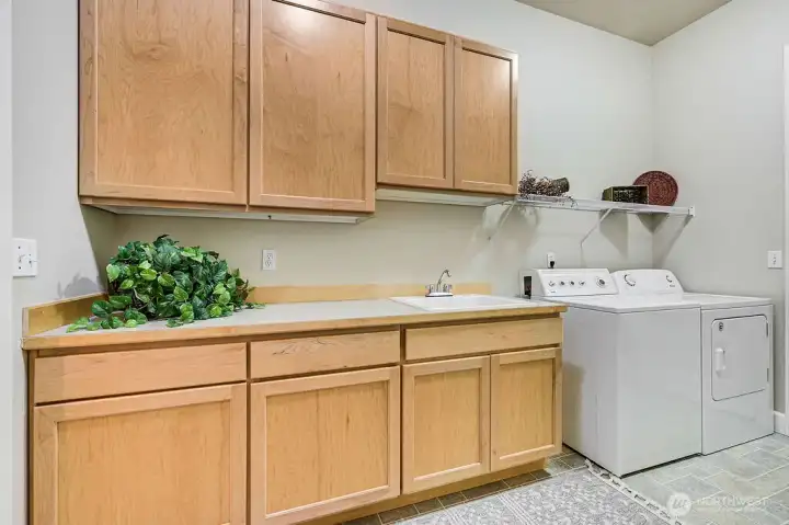 So much storage space in the utility room. Immediate access to the 2 car garage that also has an abundance of storage.