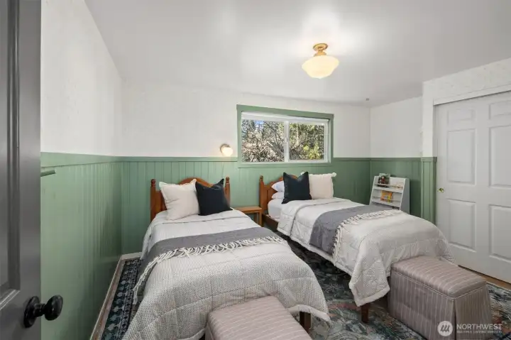 Exquisite hand-painted details enhance the classic wainscoting, creating a truly unique touch.