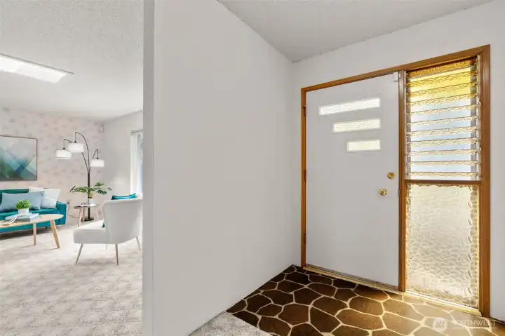 The spacious entryway offers a warm welcome, with classic finishes that have been thoughtfully preserved and make you feel right at home.