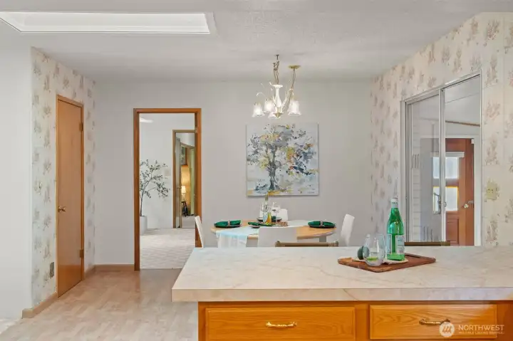 Past the dining room, the home opens into a comfortable family room with a fireplace that adds warmth and character. The large pantry is just to the left, and the enclosed bonus room to the right adds even more flexibility to the layout.