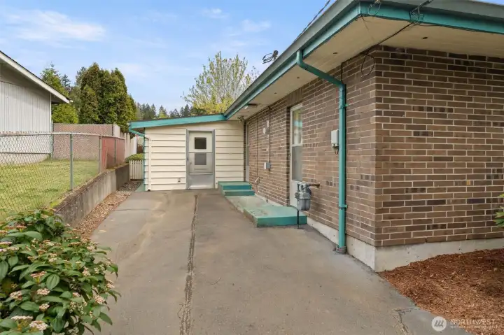 Here you’re looking at the west-facing door of the enclosed porch, and just to the right is the door that leads into the mini kitchen area we just saw.
