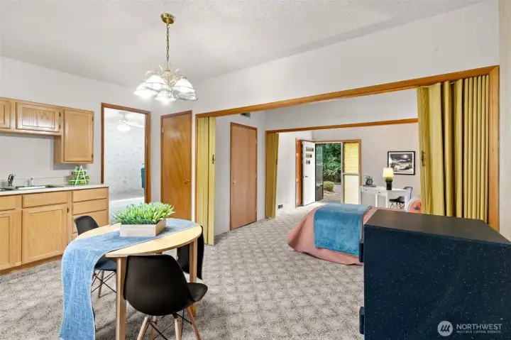 Back inside the bonus room, there’s even more flexibility here with another door that serves as a front entrance, giving the space its own easy access point.