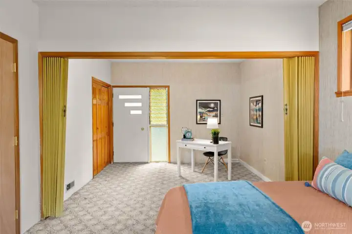 The same classic front door design is carried through here, with ripple glass and jalousie windows that give the home a cohesive, classic look.