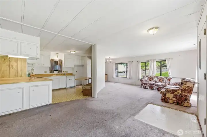 Step inside and step back in time. View of home from Family room looking toward the formal living room and kitchen.