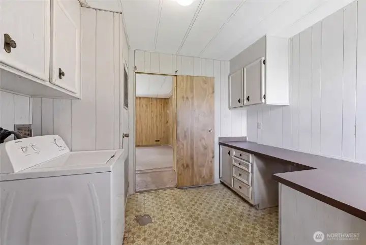Laundry/Mud/Utility room. Newer furnace located at the far side on the left behind the door.