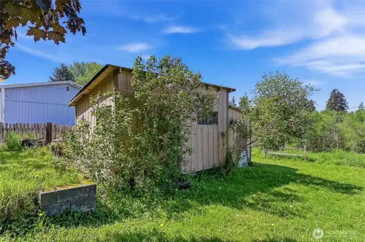 Small shop with Shed attached. The ceilings inside are not in great condition. Refurbish and have great storage. All items inside of these structures remain.
