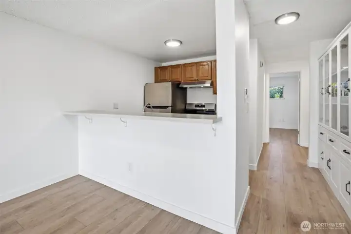 Kitchen opens to open concept living and dining space and allows for nice views to outside and peekaboo to Easter Lake