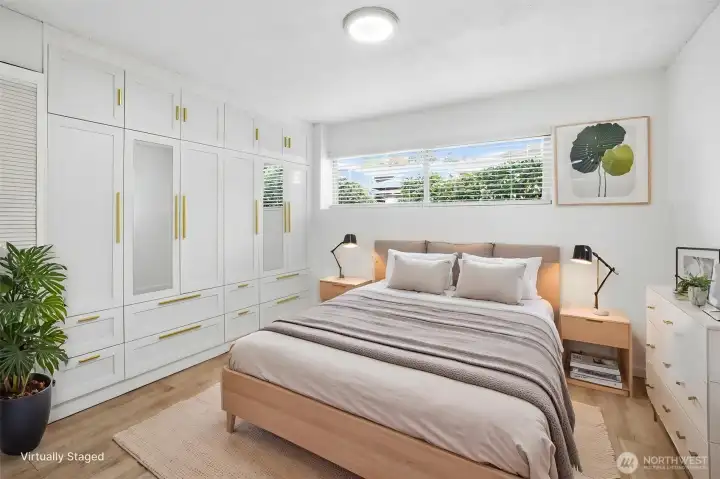 Ample and inviting primary bedroom with lots of storage.