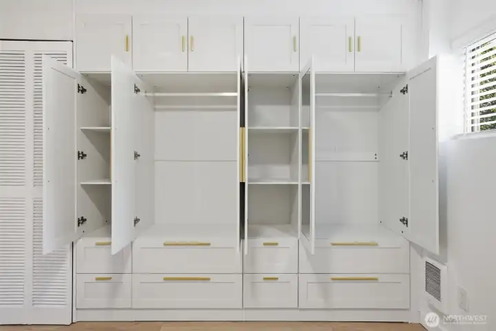 Built in cabinets in primary bedroomprovide ample and well organized storage