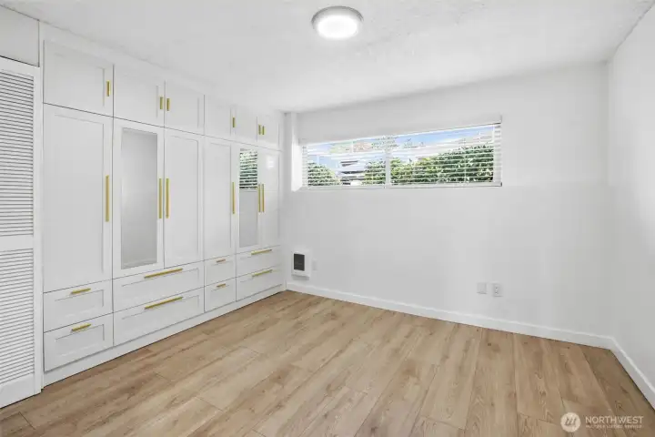 Built in cabinets in primary bedroom provide ample and well organized storage
