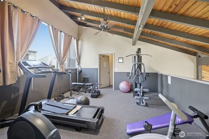 Indoor gym in clubhouse for use, located just steps from condo