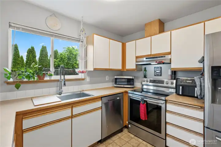 Stainless appliances and a backyard view make everyday tasks a little more enjoyable.