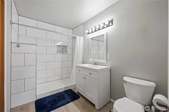 Beautifully updated with a stunning tile shower and modern vanity.
