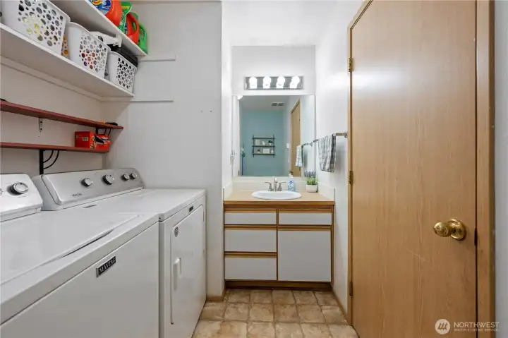 Convenient main floor laundry room with half bathroom.