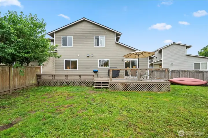 A fully fenced backyard ready for pets, play, gardening, and summer gatherings.