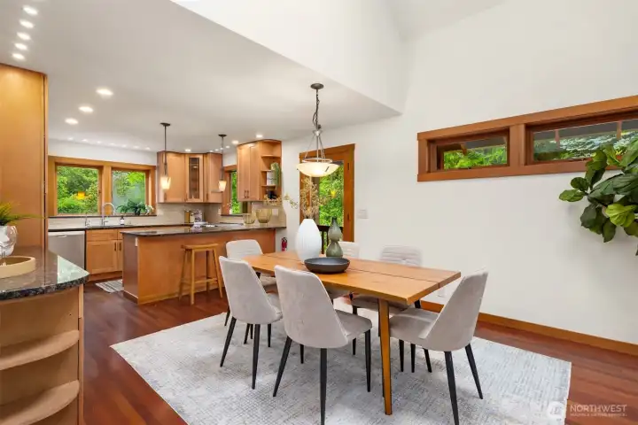 Light-filled dining space with views of the surrounding greenery and easy access to outdoor entertaining areas.