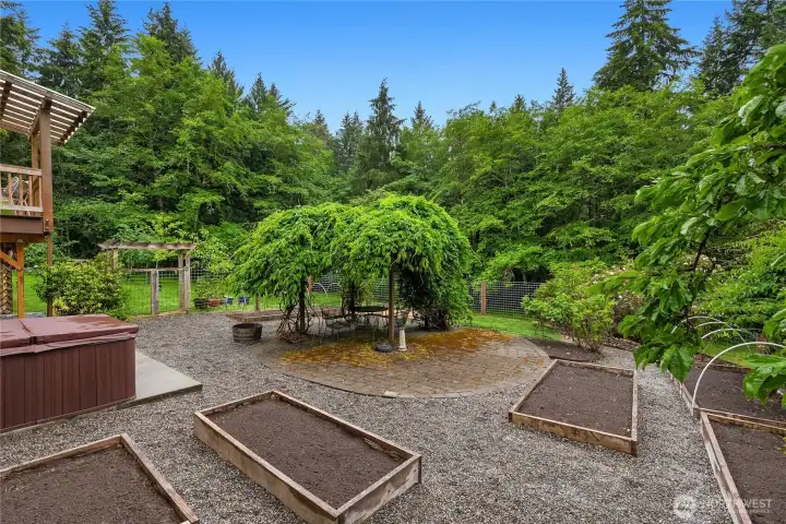 Raised garden beds create the perfect setting for homegrown produce and seasonal blooms.