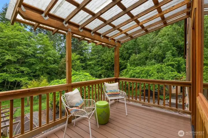 Covered outdoor living space extends enjoyment of the property throughout the seasons.