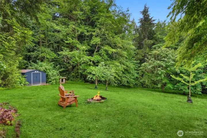 Surrounded by towering evergreens and natural beauty, the property offers a peaceful connection to the outdoors."