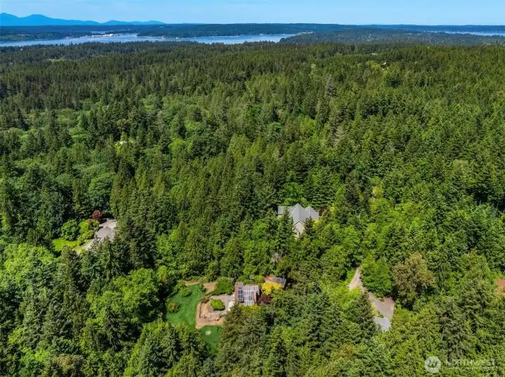Aerial view showcasing the property's rare privacy and surrounding natural beauty.