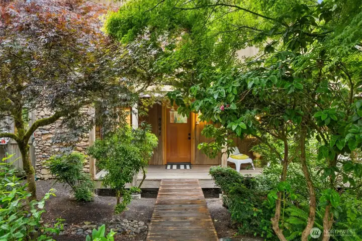 Arrive home through a peaceful woodland setting that feels worlds away from the city.