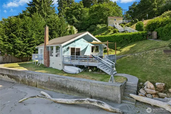 Just steps from the deck, a stretch of shoreline invites beach combing and waterfront adventures!