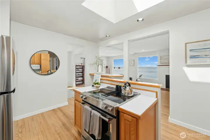 A skylight above the cooktop fills the kitchen with natural light throughout the day.