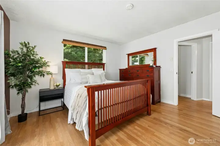 Unwind and awaken to views of the water from your primary bedroom.