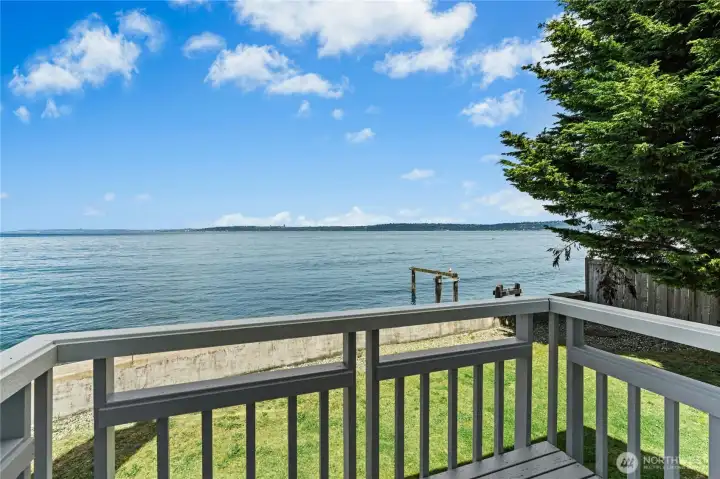 Step outside from the primary bedroom to enjoy fresh sea air and tranquil views.