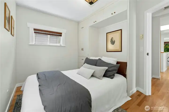 A versatile guest bedroom featuring a Murphy bed.