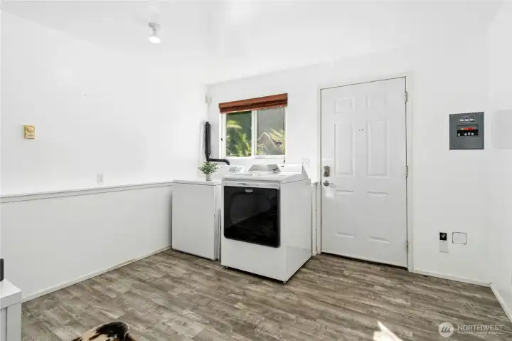 Laundry area tucked near the entry.