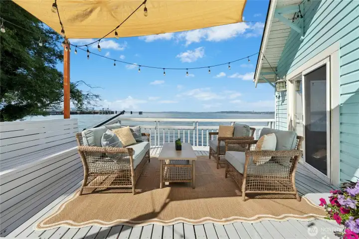 A view filled deck offers the perfect spot to host gatherings, unwind and watch the tides roll by.