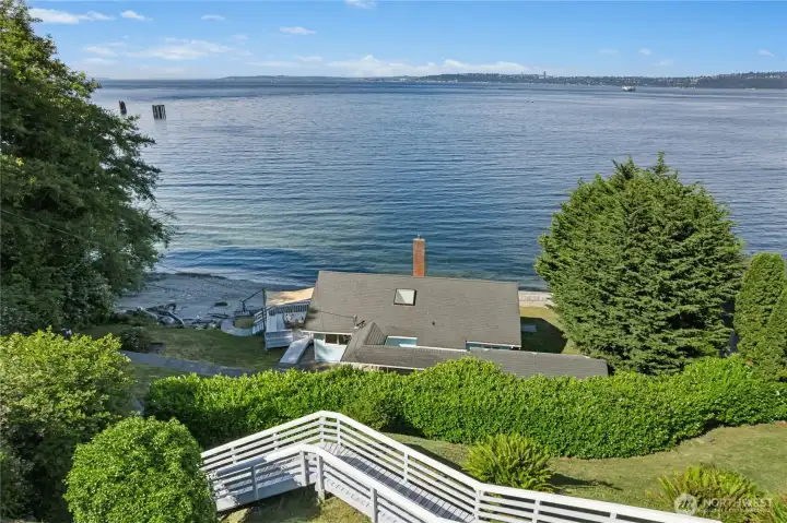 Newly refreshed wooden stairs lead the way to the home.