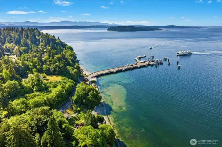 Ariel perspective showcasing the home's peaceful setting, with wooded surroundings, waterfront and convenient access to the Vashon ferry terminal.