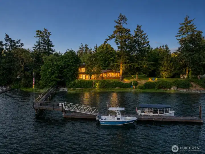 Private Deer Harbor waterfront retreat on Orcas Island with protected cove frontage, calm usable water access, private dock and moorage potential, and a seamless connection between the home, shoreline, deck, and dock.